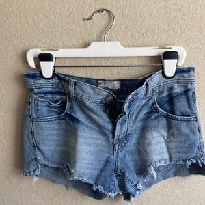 Free People denim jean shorts with frayed raw hem